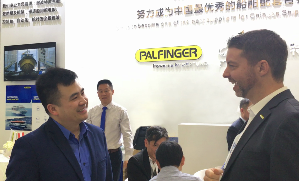 Ji Tang and Felix Strohbichler, member of PALFINGERs executive board, at Marintec China 2019, celebrating PALFINGER NEPTUNE's first public appearance.