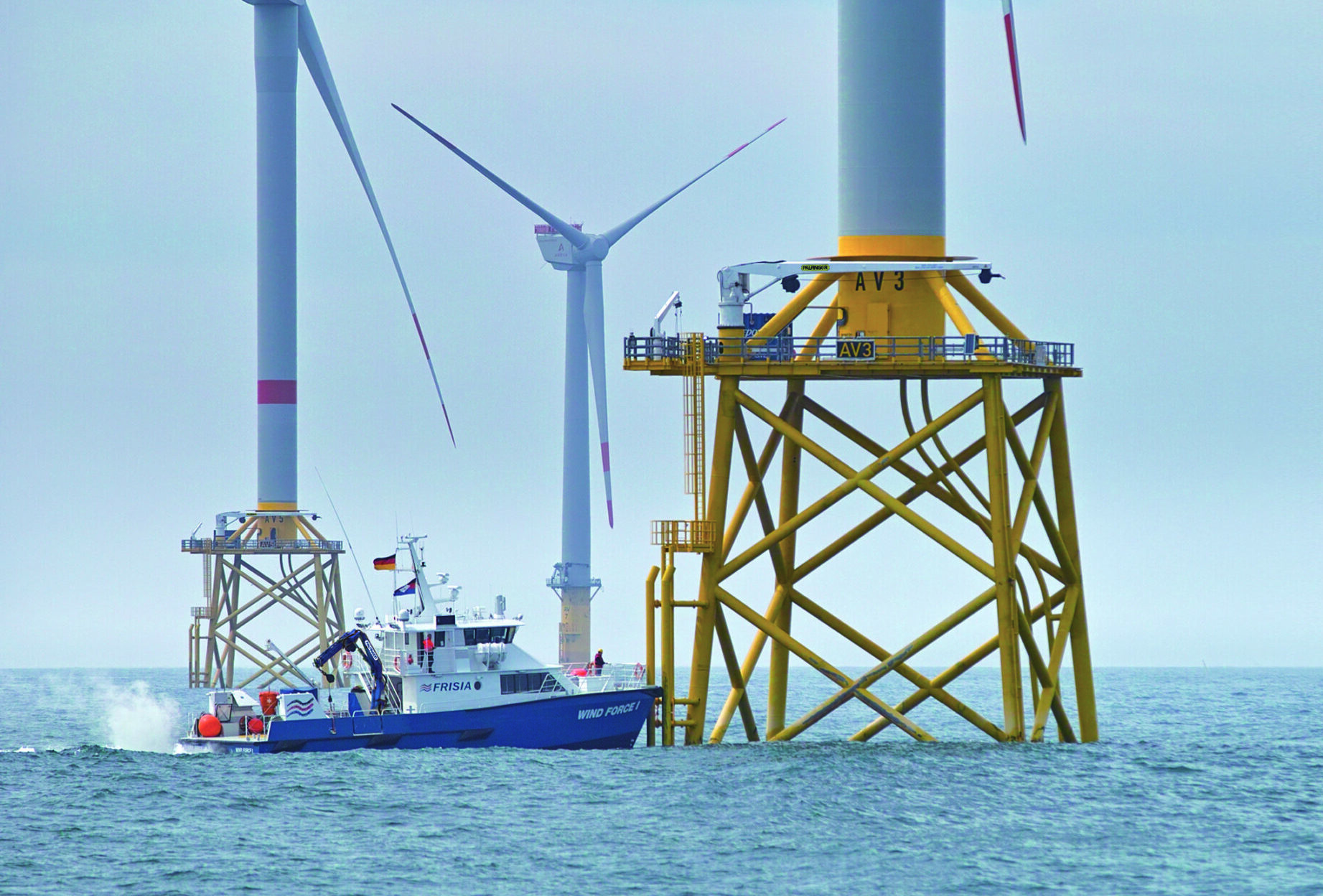 Offshore support vessel approaching an offshore wind turbine