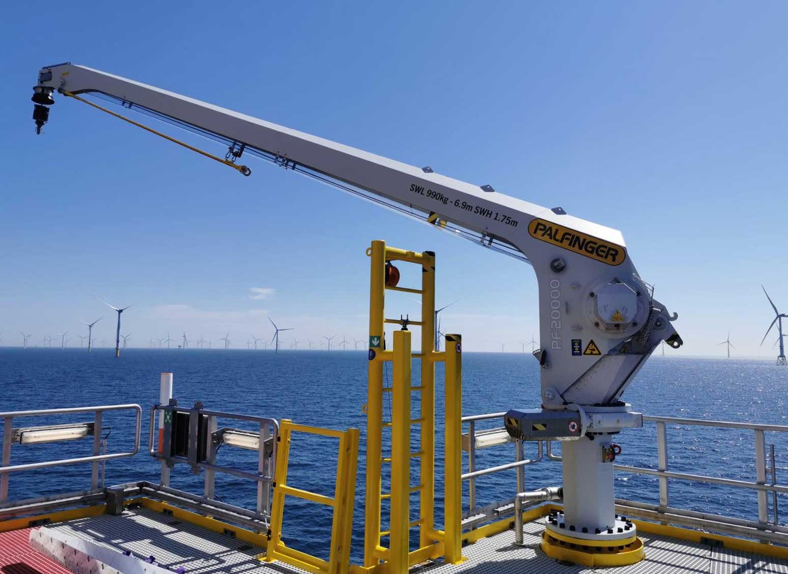 PALFINGER fixed boom crane onboard an offshore installation in an offshore wind park setting