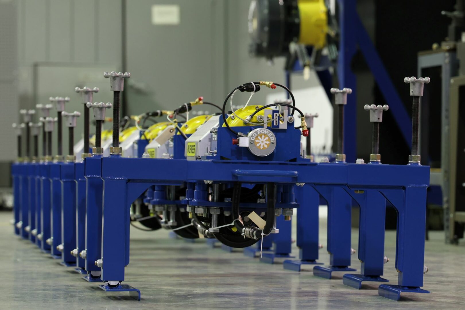 A number of PALFINGER lifeboat engine test stands in a consecutive row